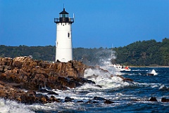 Portsmouth Harbor Lighthouse Guiding Fishing Boat in NH